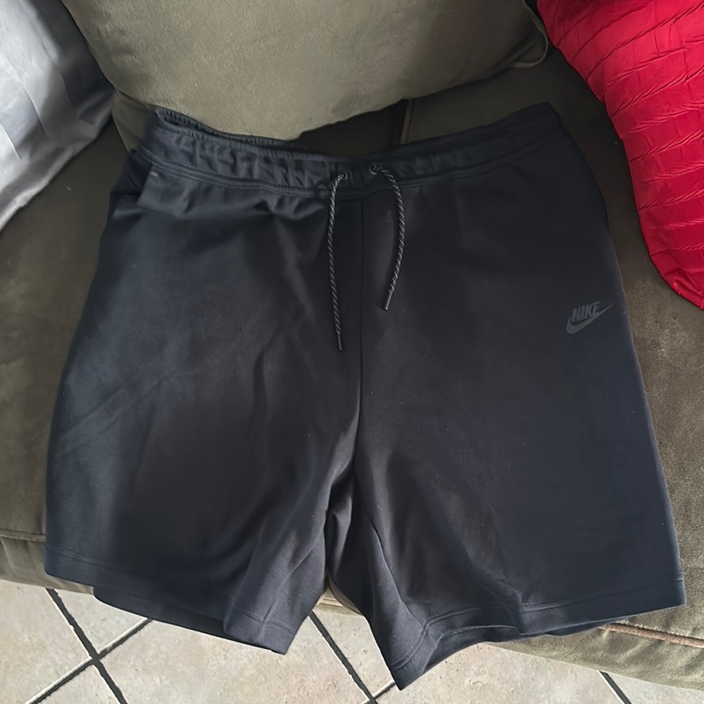 Nike Black Athletic Shorts with Mid-Thigh Length and Smooth Texture